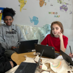 Four kids sitting at a table